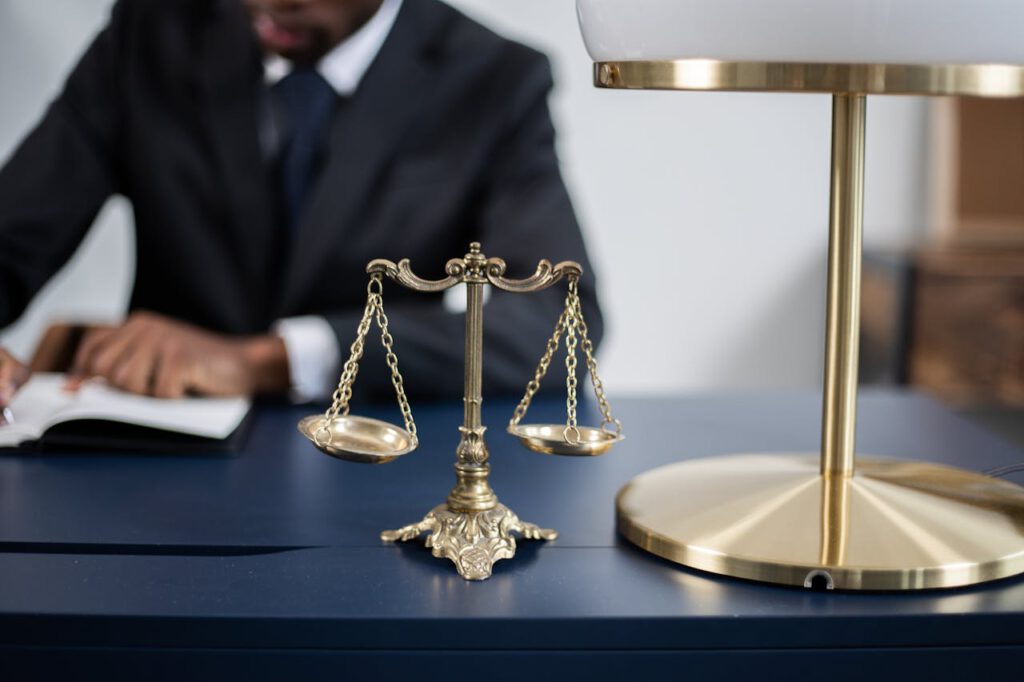 The Art of Drawing Readers In: Your attractive post title goes here Elegant legal office with a close-up of golden scales of justice on a sleek dark desk.